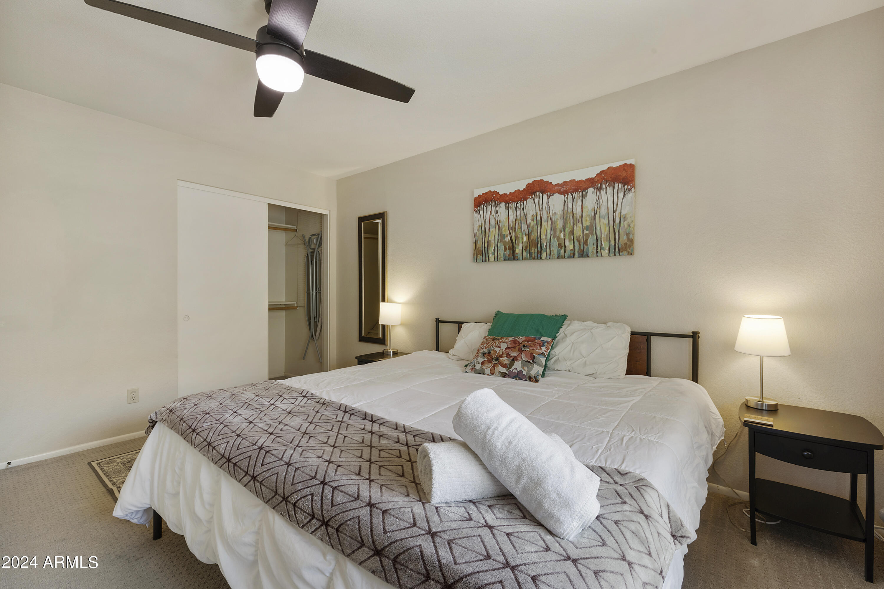 1223 North Granite Reef Road Scottsdale, AZ 85257 - Photo 4 of 35 a bedroom with a bed and a painting on the wall