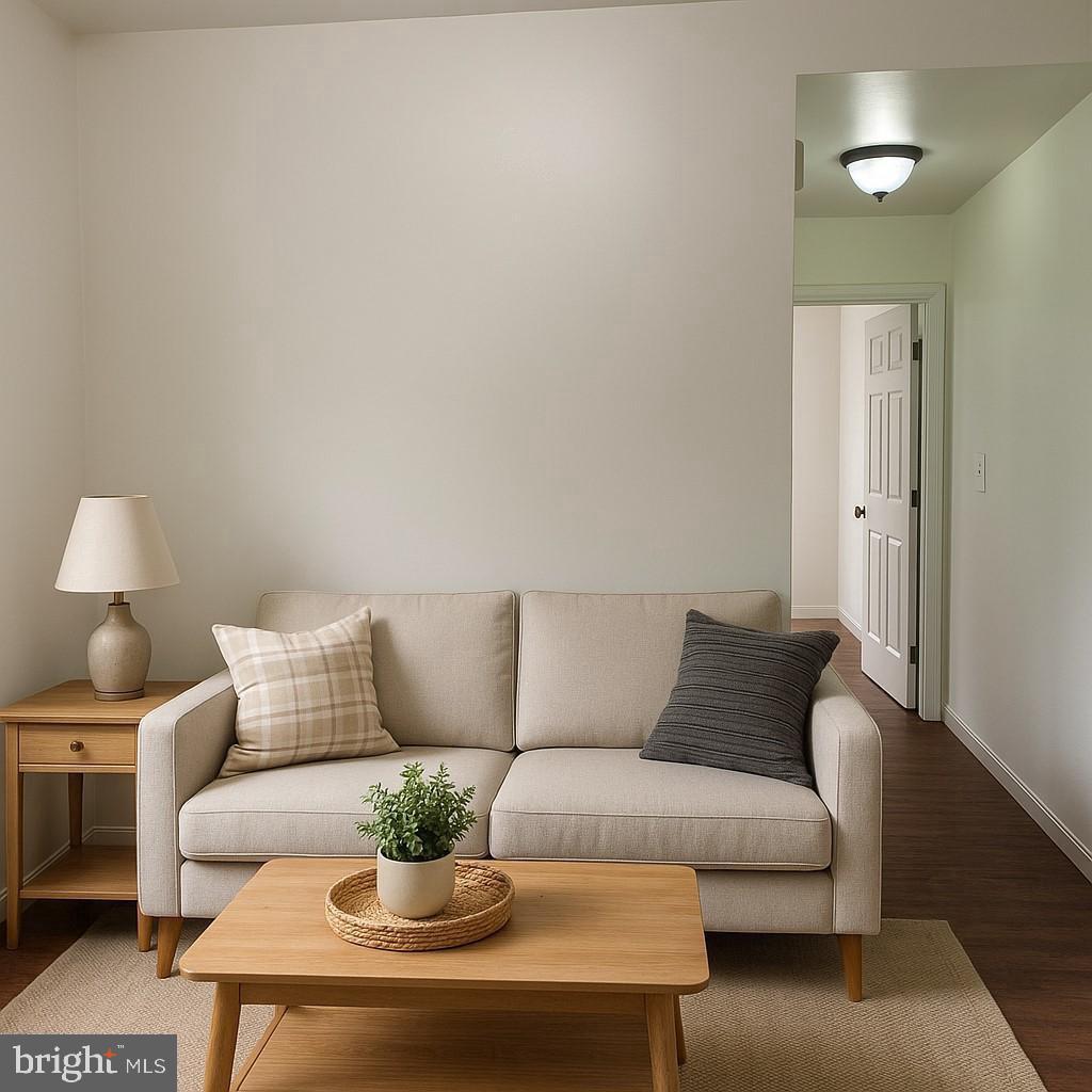 6041 Vine Street Philadelphia, PA 19139 - Photo 2 of 10 a living room with furniture and a lamp