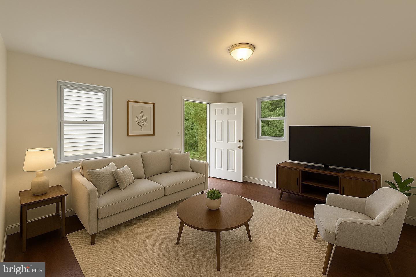 6041 Vine Street Philadelphia, PA 19139 - Photo 3 of 10 a living room with furniture and a flat screen tv