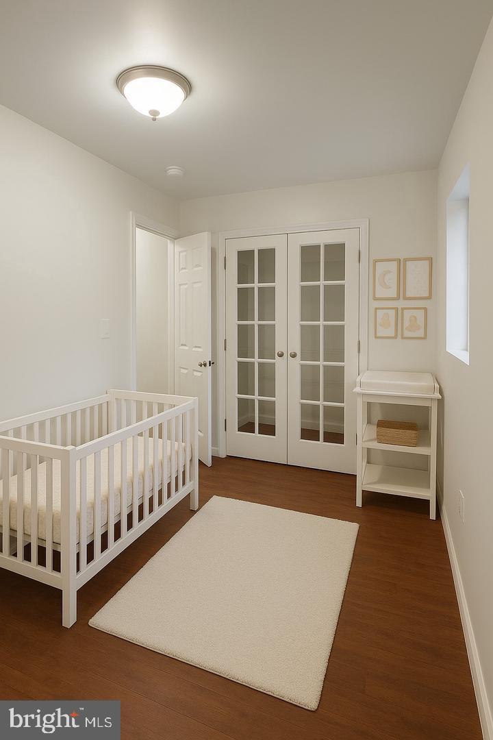 6041 Vine Street Philadelphia, PA 19139 - Photo 4 of 10 a view of a bedroom with furniture and windows
