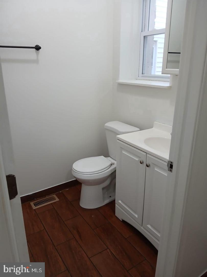 6041 Vine Street Philadelphia, PA 19139 - Photo 8 of 10 a bathroom with a sink and a toilet
