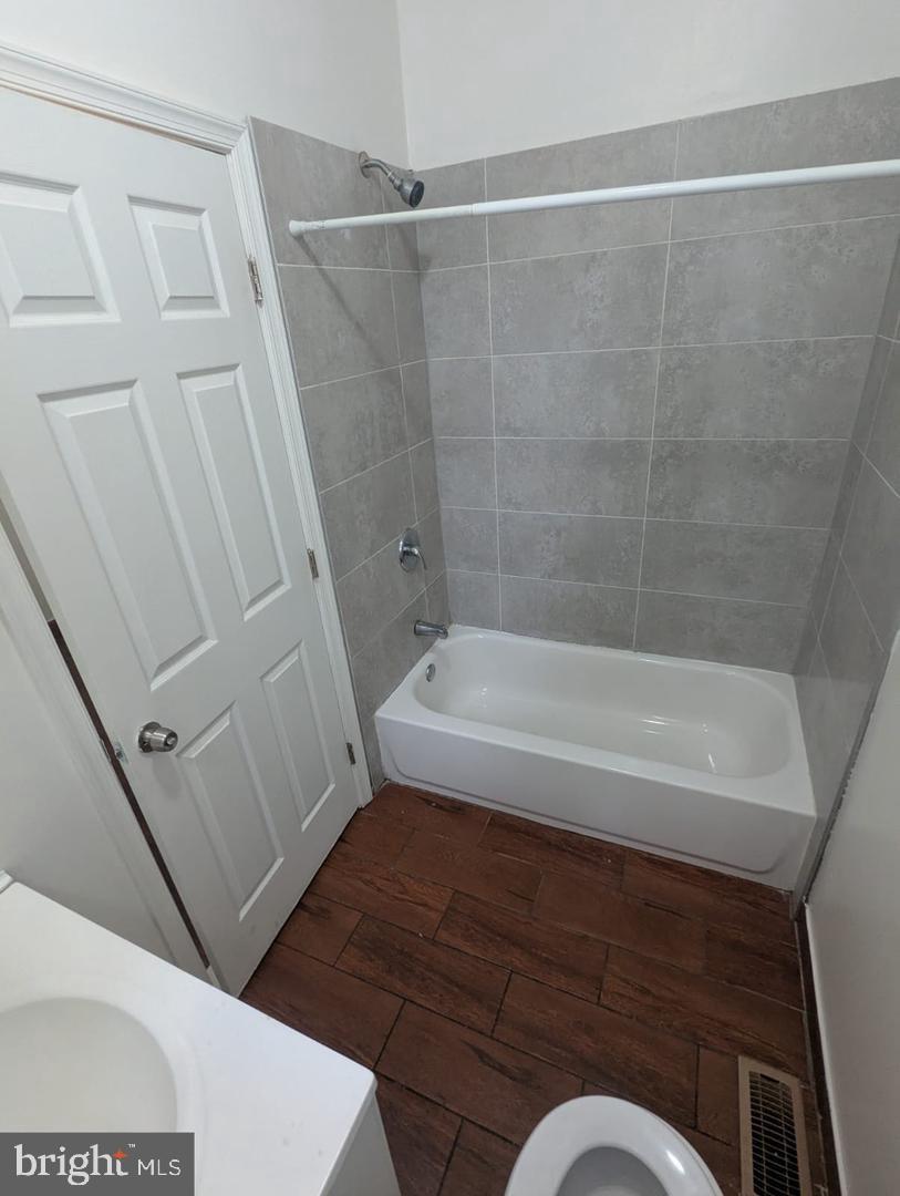 6041 Vine Street Philadelphia, PA 19139 - Photo 10 of 10 a bathroom with a sink and a bathtub