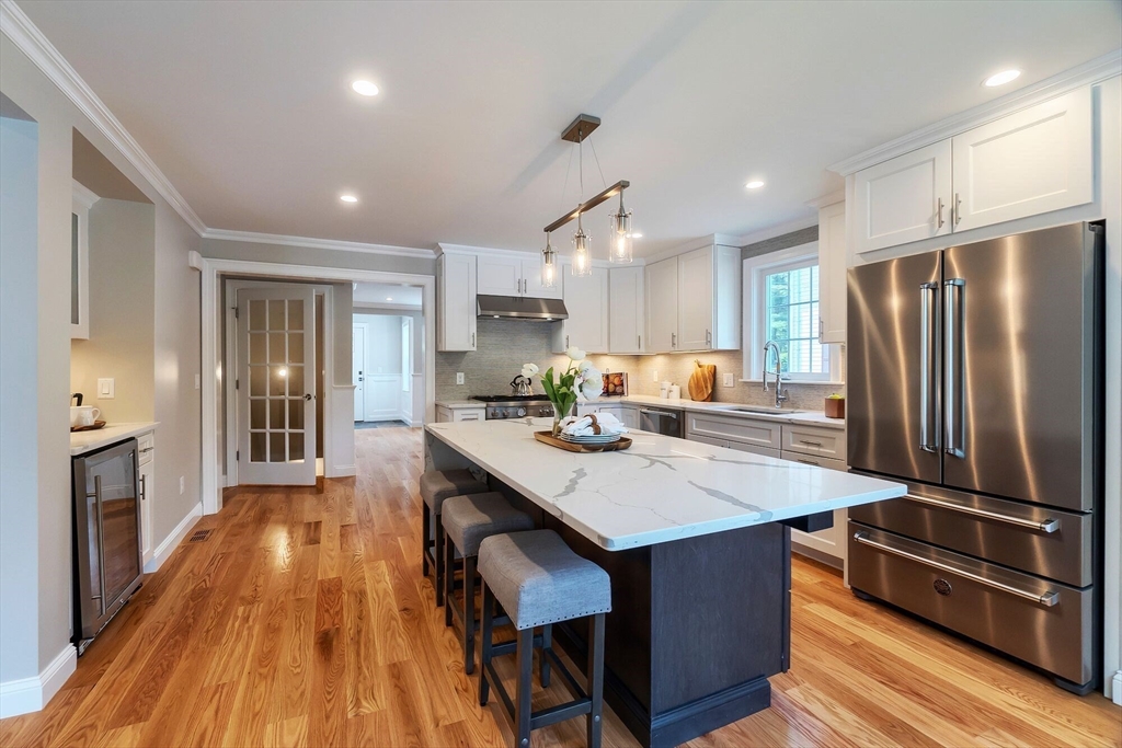 a kitchen with counter top space and stainless steel appliances