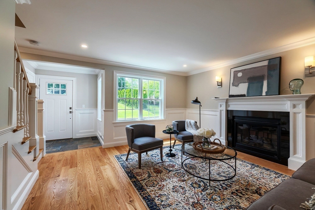 269 Dale Street, Unit 1 Waltham, MA 02451 - Photo 12 of 42 a living room with furniture and a fireplace