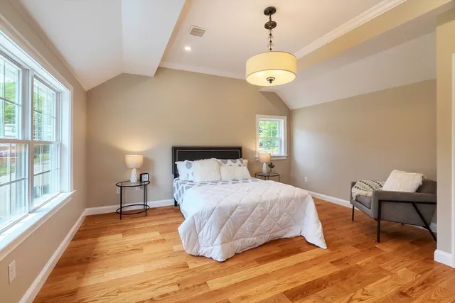 a bedroom with a bed and window