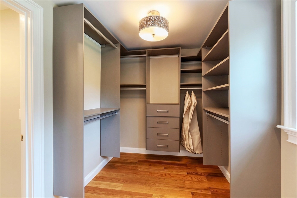 269 Dale Street, Unit 1 Waltham, MA 02451 - Photo 20 of 42 a view of walk in closet with clothes and shoes