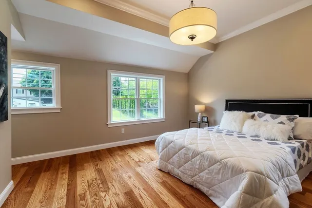 a bedroom with a large bed and a large window