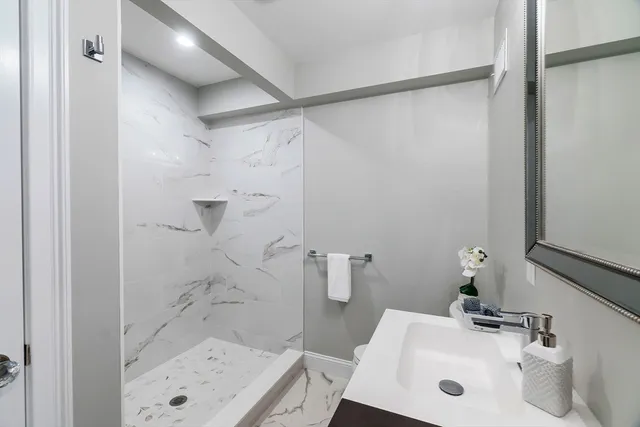 a bathroom with a sink and shower