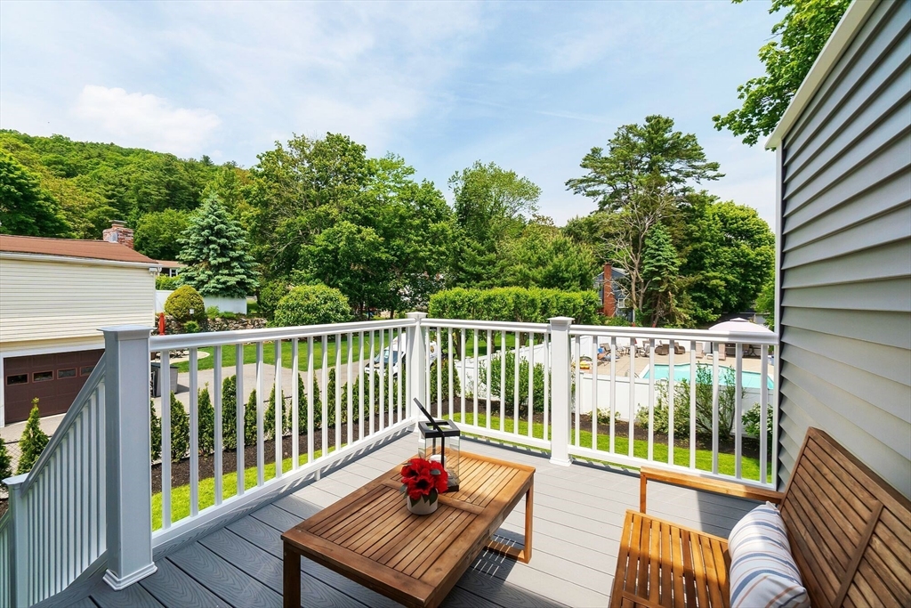 269 Dale Street, Unit 1 Waltham, MA 02451 - Photo 27 of 42 a balcony with wooden floor and outdoor seating