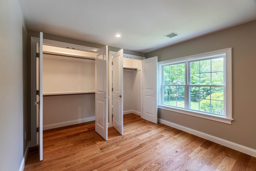269 Dale Street, Unit 1 Waltham, MA 02451 - Photo 33 of 42 a view of empty room with wooden floor and window