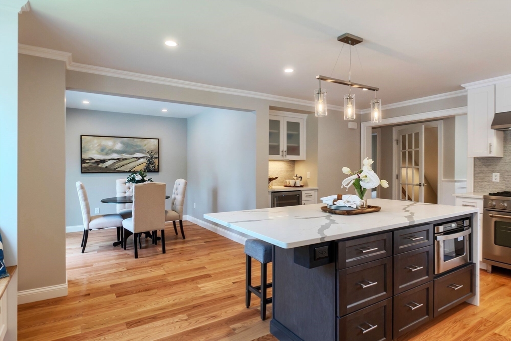269 Dale Street, Unit 1 Waltham, MA 02451 - Photo 4 of 42 a view of a dining room and a table and chairs
