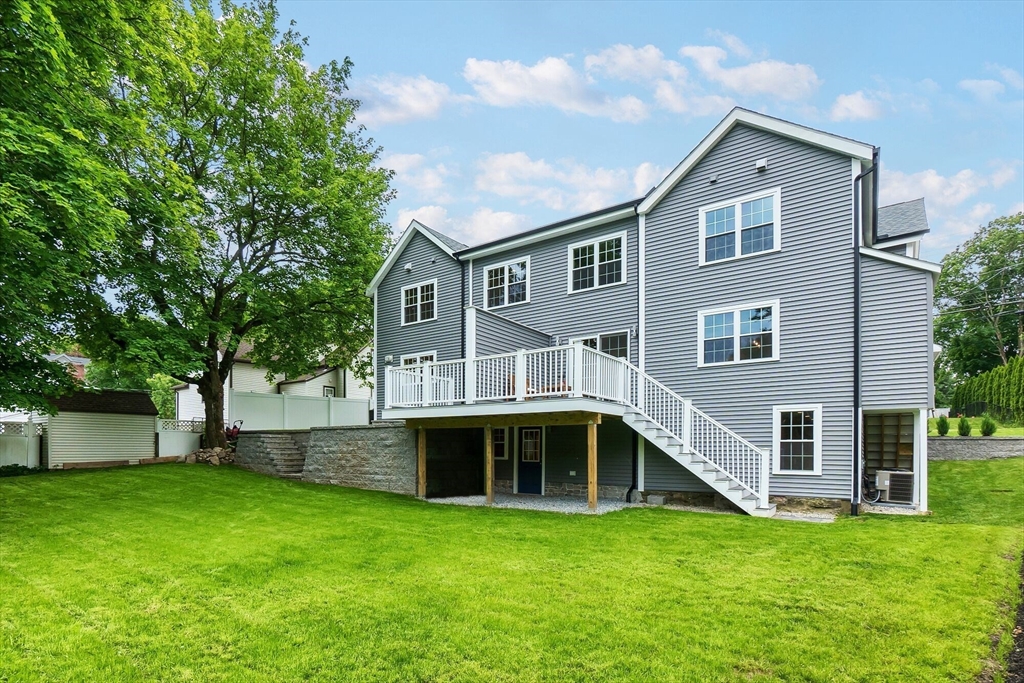 269 Dale Street, Unit 1 Waltham, MA 02451 - Photo 42 of 42 a front view of a house with a garden