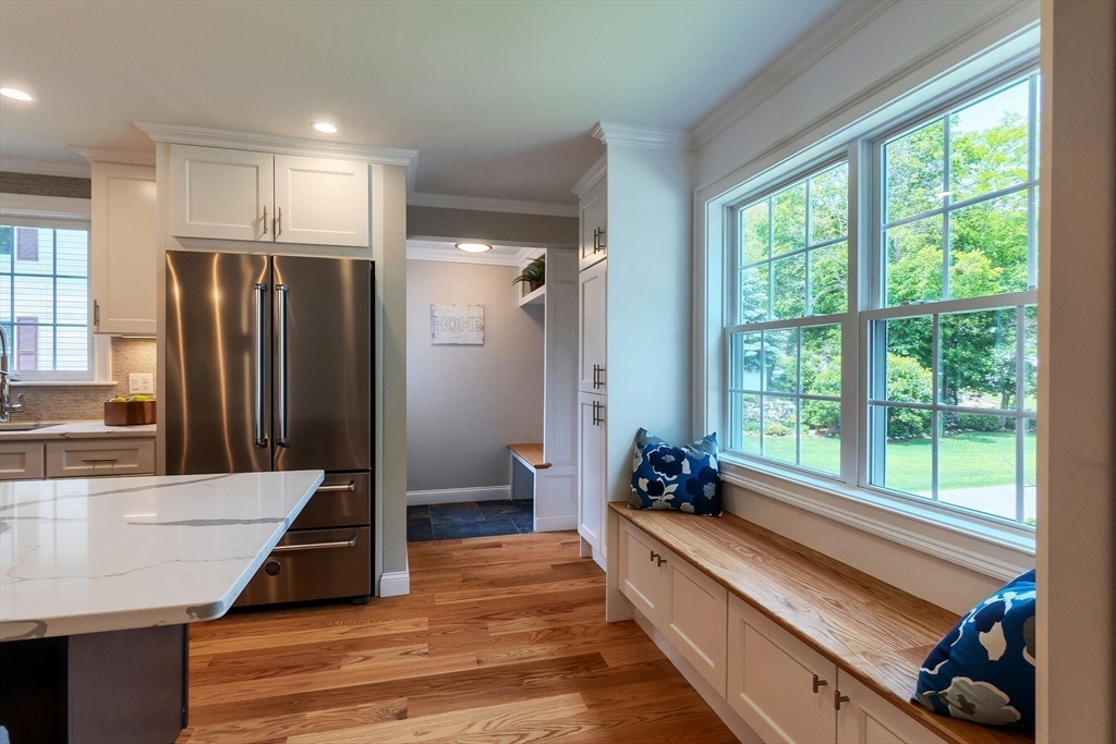 269 Dale Street, Unit 1 Waltham, MA 02451 - Photo 6 of 42 a large kitchen with stainless steel appliances wooden floor and a large window