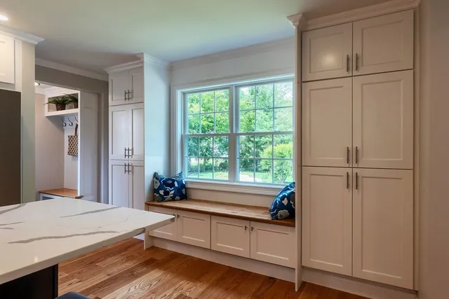 a spacious bedroom with a bed and a window