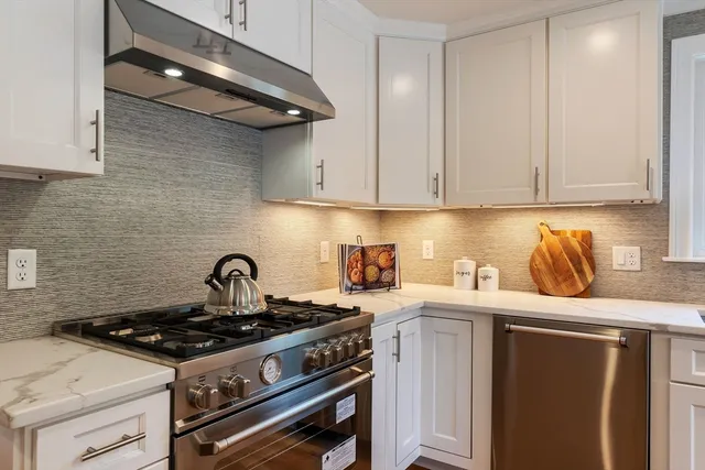 a kitchen with a stove and a cabinets