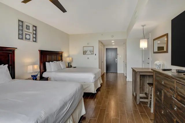 a bedroom with a bed and a table