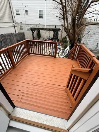 a view of outdoor space with deck and furniture