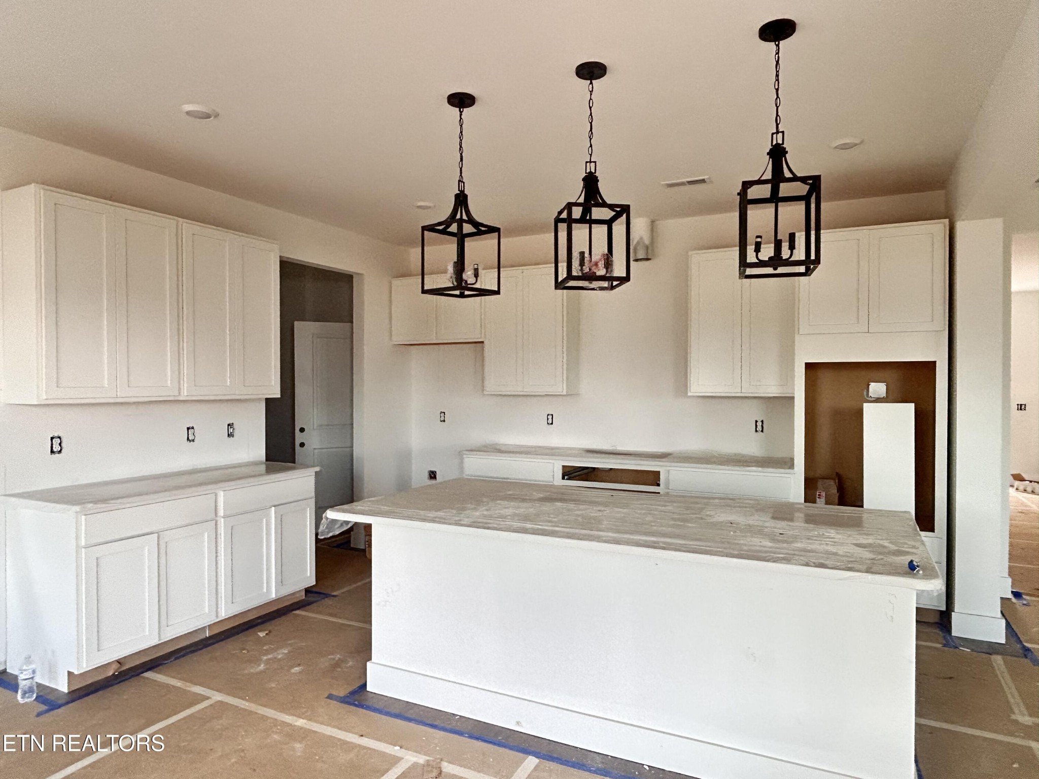 423 Ivey Farms Road Knoxville, TN 37934 - Photo 3 of 20 a kitchen that has a lot of cabinets and appliances