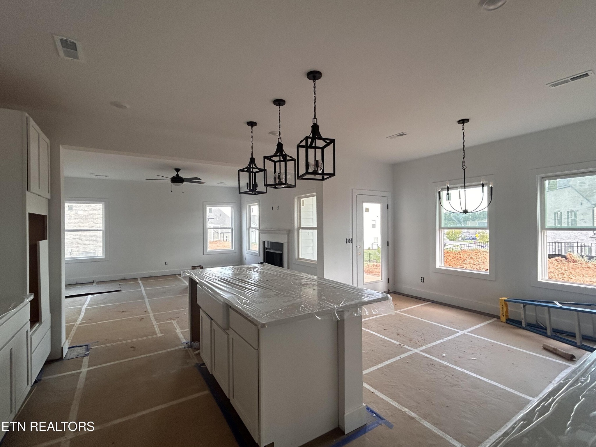 423 Ivey Farms Road Knoxville, TN 37934 - Photo 5 of 20 a kitchen with a stove a sink and chandelier