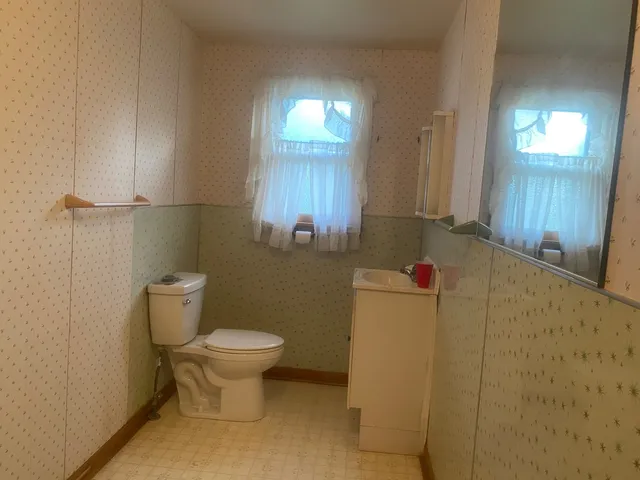 a bathroom with a toilet and a sink