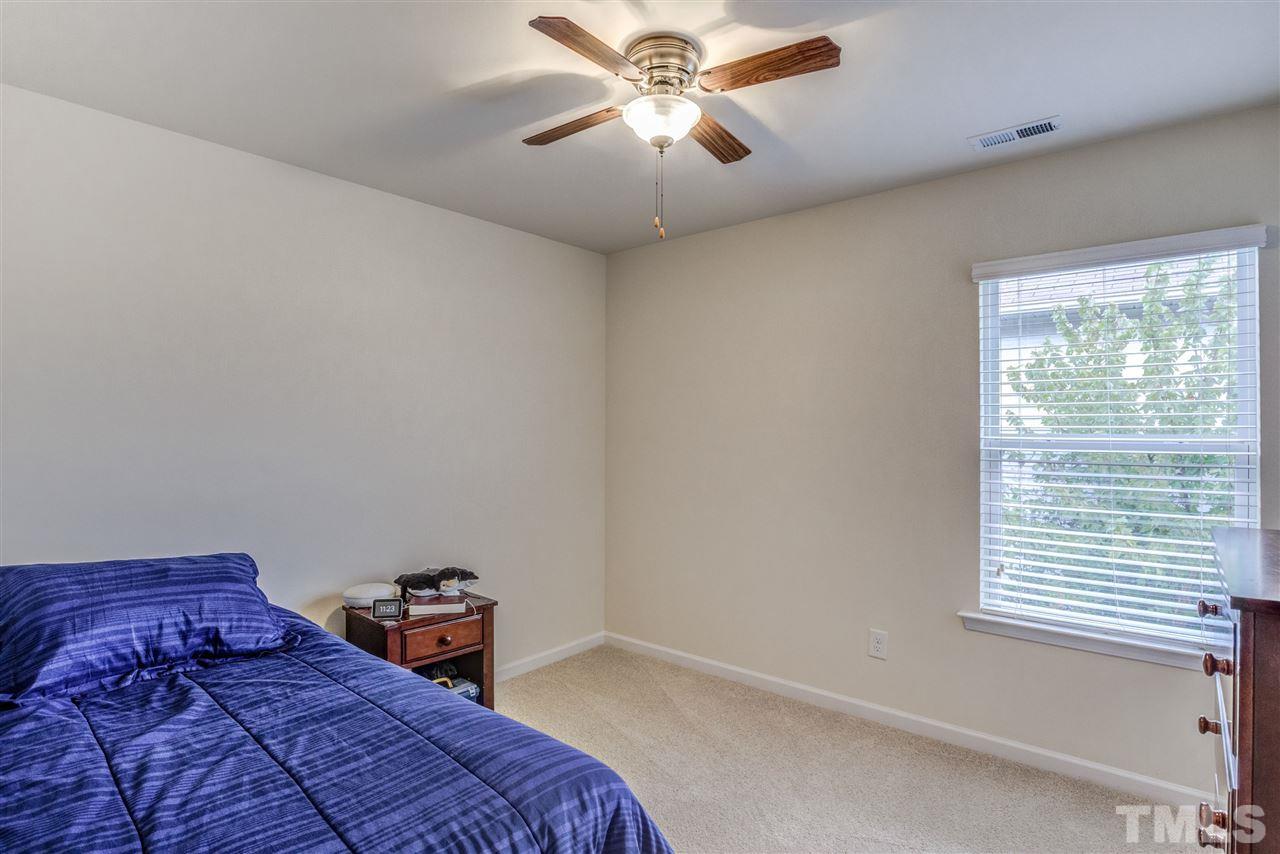 3604 Althorp Drive Raleigh, NC 27616 - Photo 21 of 30 This seconday bedroom also offers a ceiling fan and a walk in closet.