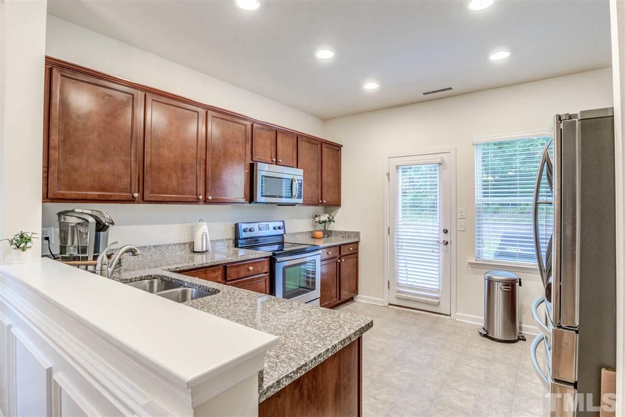 3604 Althorp Drive Raleigh, NC 27616 - Photo 9 of 30 So much space in this kitchen. Granite counter tops, stainless steel appliances.