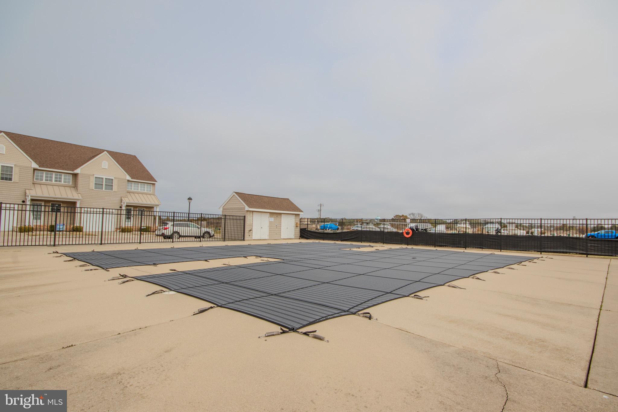 112 B Sunset Circle, Unit 112B Crisfield, MD 21817 - Photo 5 of 54 In-ground Pool directly across from unit!