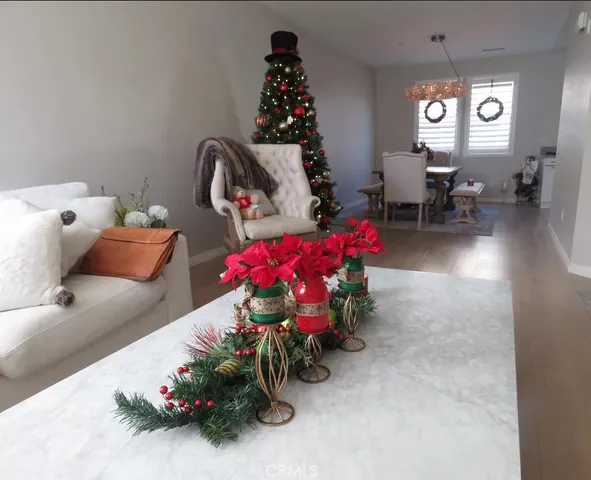 a living room with furniture and flowers