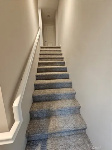 a view of a hallway with stairs
