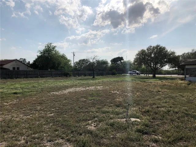 a view of outdoor space with deck and yard
