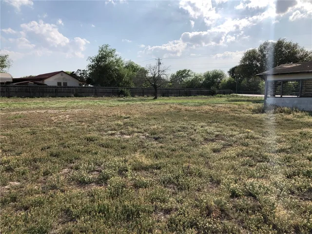 a view of outdoor space with deck and yard