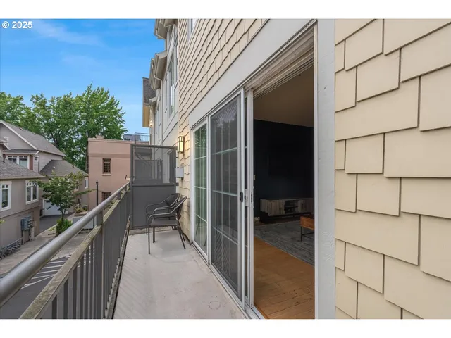 a view of a balcony with chairs