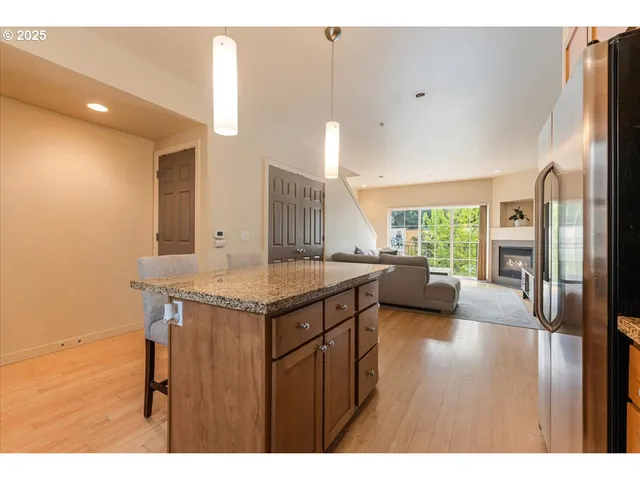 a view of a kitchen with a sink and living room