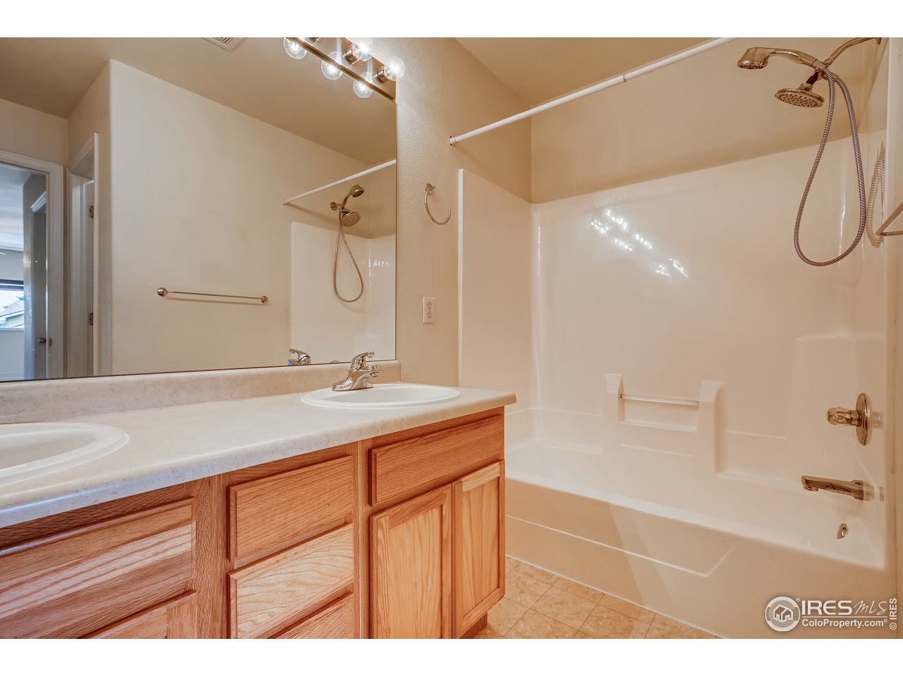2702 Rigden Parkway, Unit A3 Fort Collins, CO 80525 - Photo 17 of 33 a bathroom with a sink a vanity and a mirror