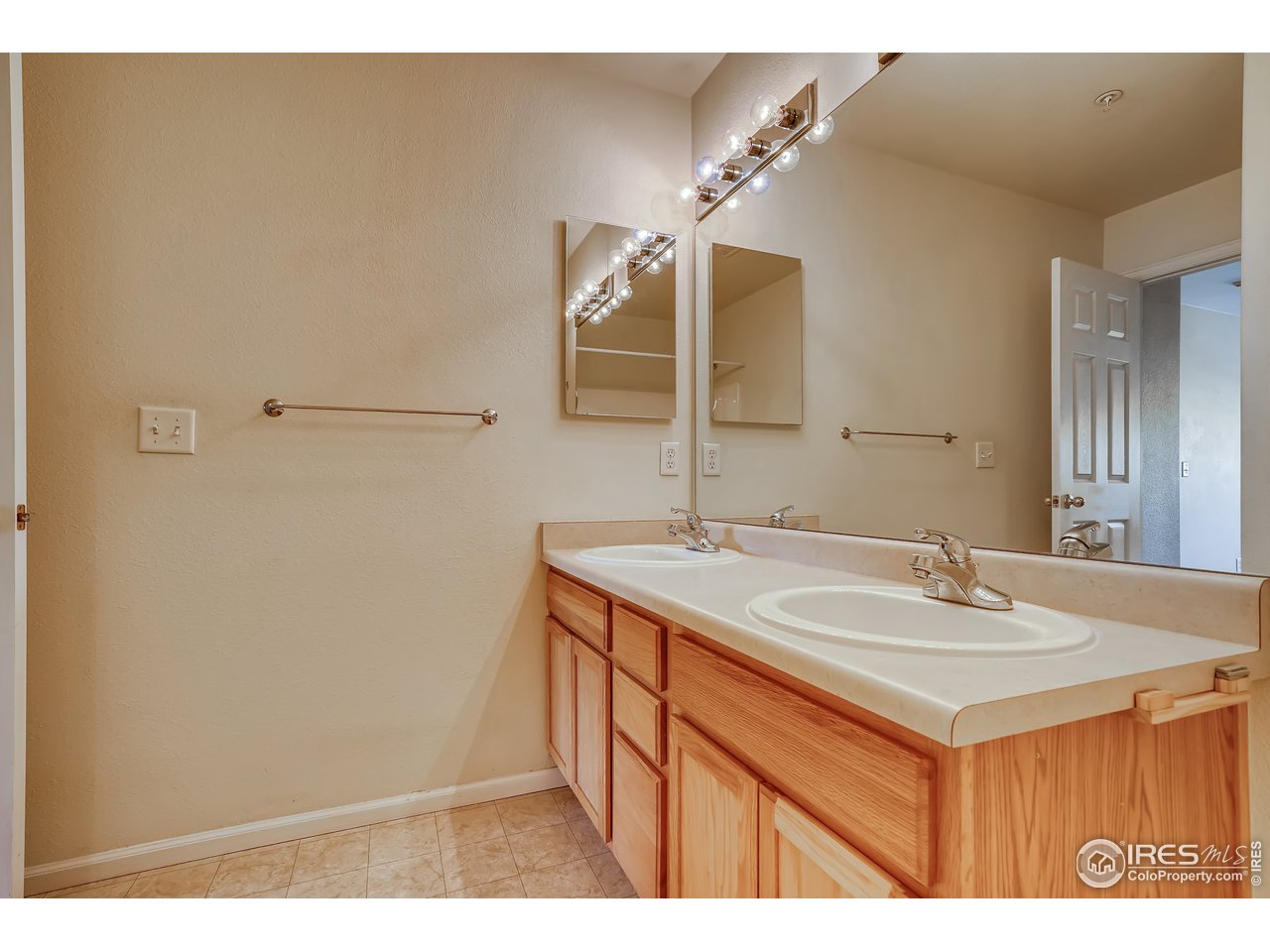 2702 Rigden Parkway, Unit A3 Fort Collins, CO 80525 - Photo 18 of 33 a bathroom with a sink and a mirror