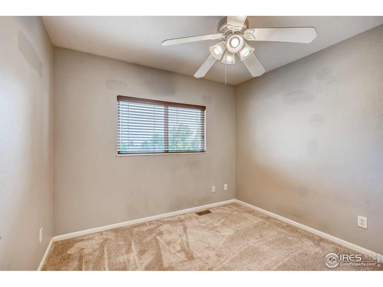 2702 Rigden Parkway, Unit A3 Fort Collins, CO 80525 - Photo 19 of 33 a view of an empty room with a window