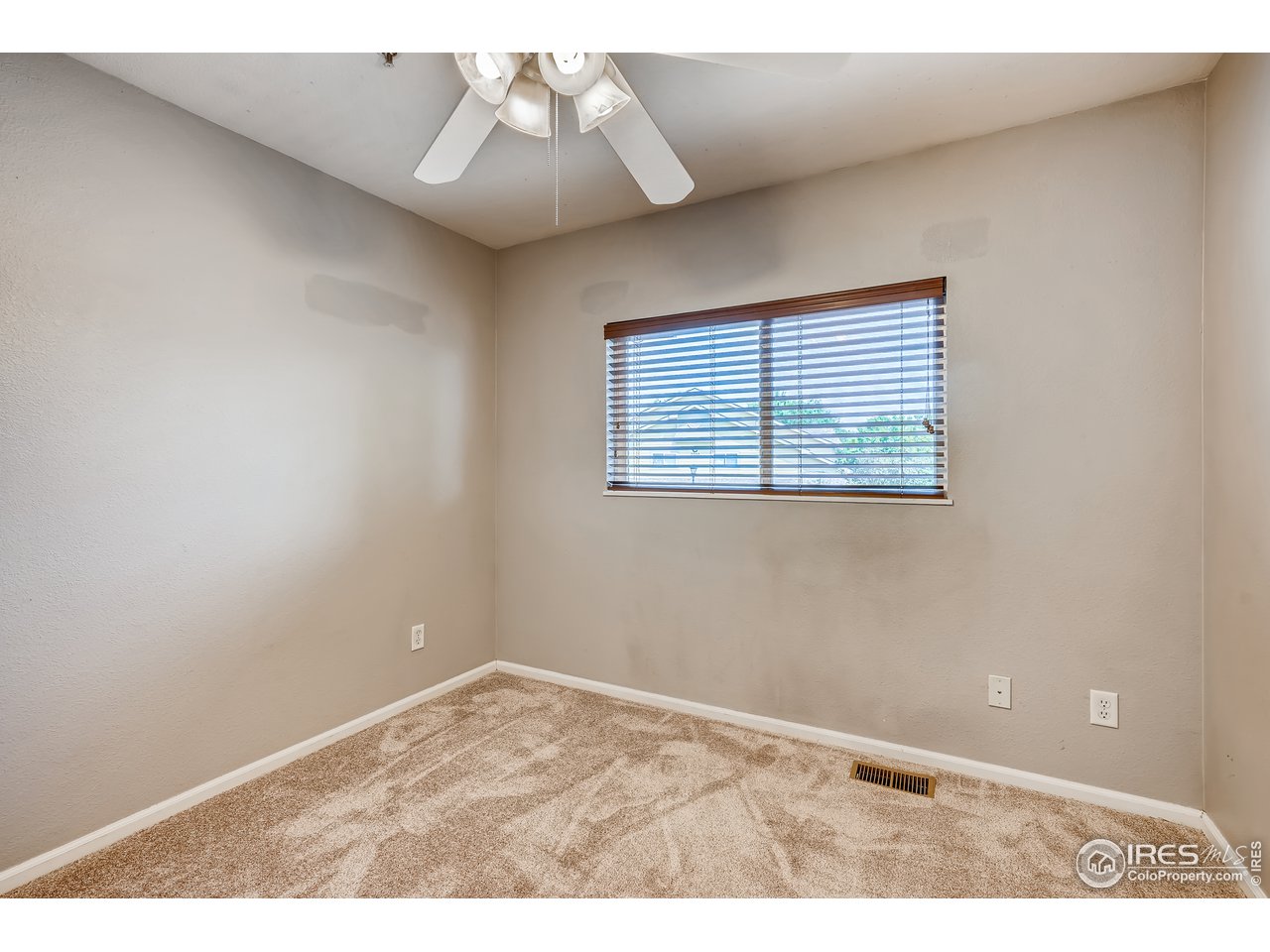 2702 Rigden Parkway, Unit A3 Fort Collins, CO 80525 - Photo 22 of 33 a view of an empty room with a window