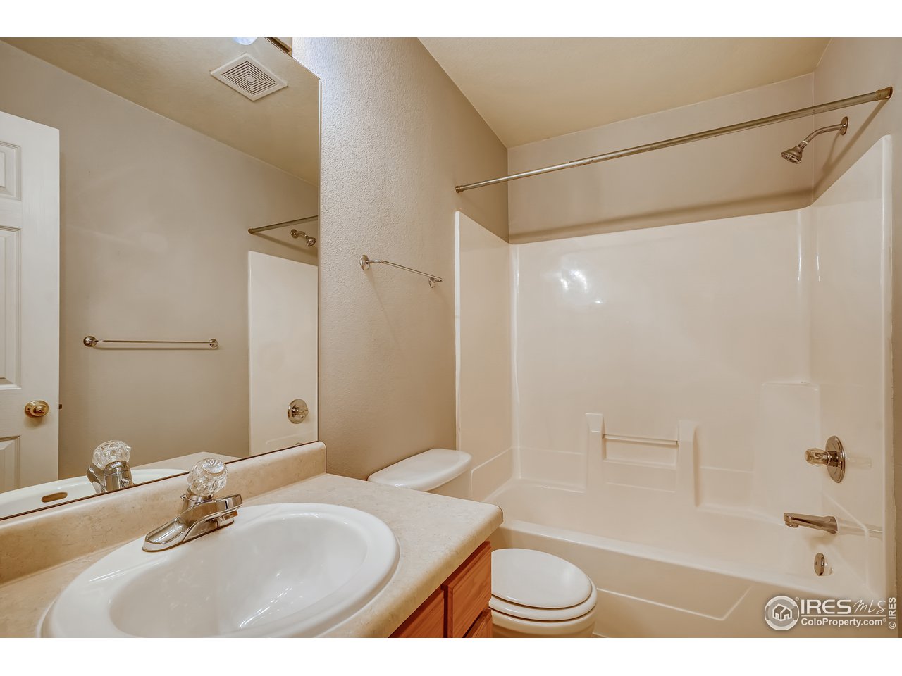 2702 Rigden Parkway, Unit A3 Fort Collins, CO 80525 - Photo 23 of 33 a bathroom with a granite countertop sink a toilet and shower