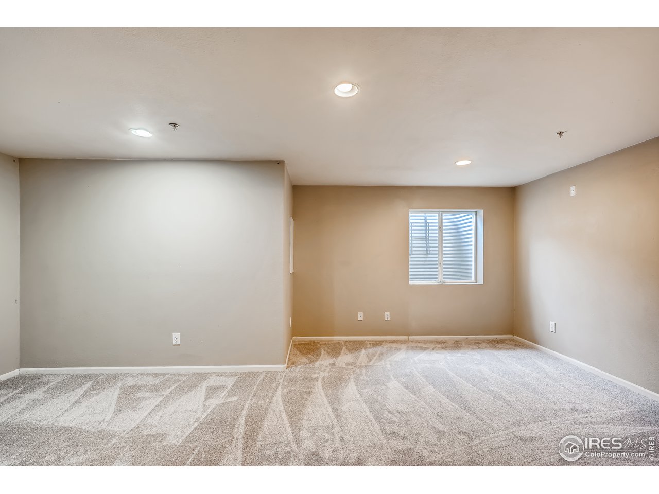 2702 Rigden Parkway, Unit A3 Fort Collins, CO 80525 - Photo 29 of 33 a view of an empty room with a window