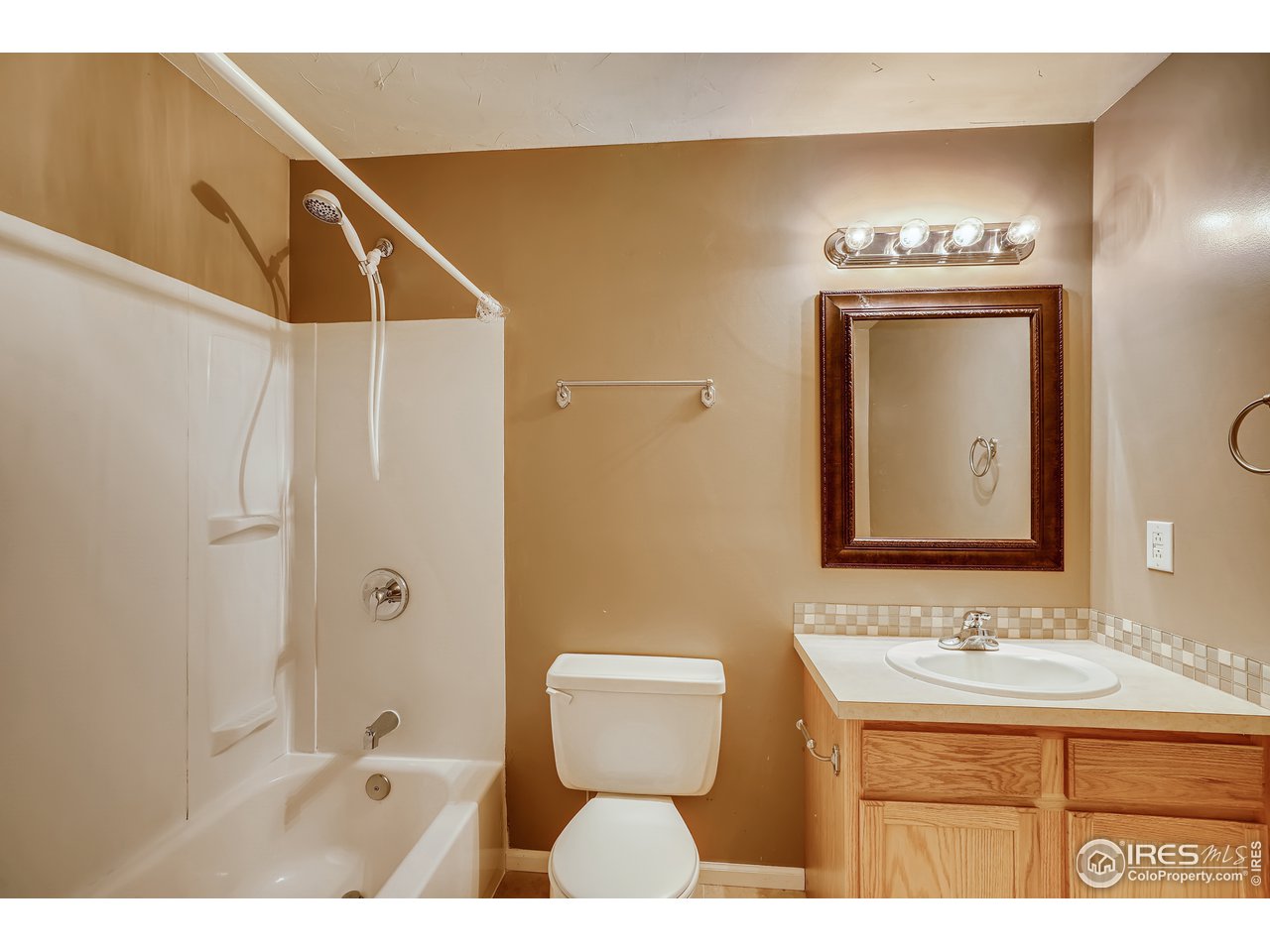 2702 Rigden Parkway, Unit A3 Fort Collins, CO 80525 - Photo 30 of 33 a bathroom with a sink a toilet and mirror