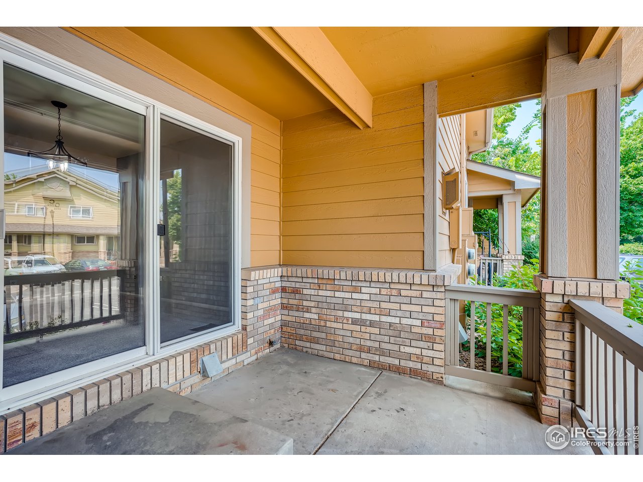 2702 Rigden Parkway, Unit A3 Fort Collins, CO 80525 - Photo 31 of 33 a view of a porch with a bench