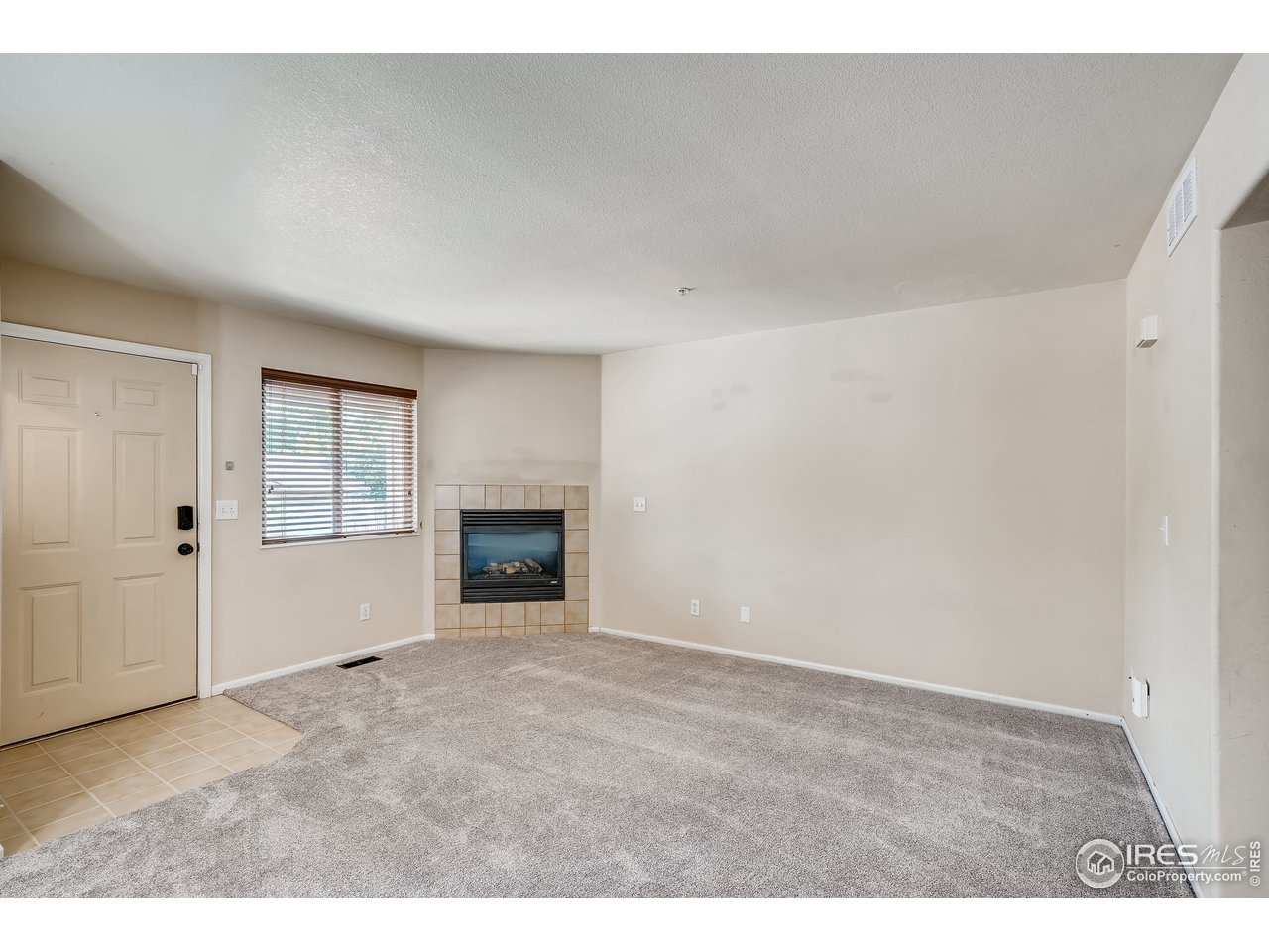 2702 Rigden Parkway, Unit A3 Fort Collins, CO 80525 - Photo 4 of 33 a view of an empty room with a window