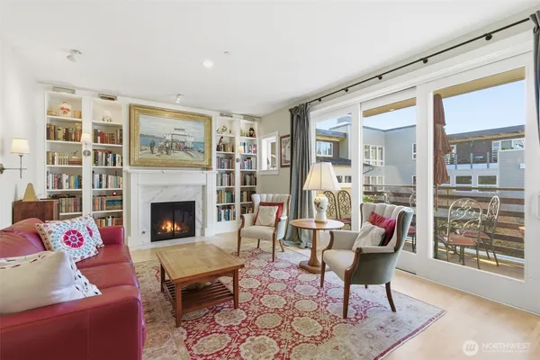 a living room with furniture or outdoor dining table and a fireplace
