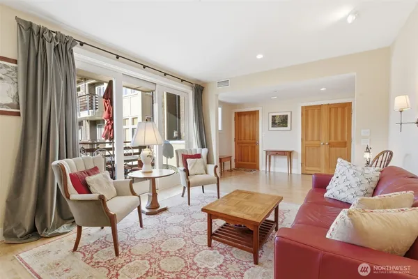 a living room with furniture and a large window