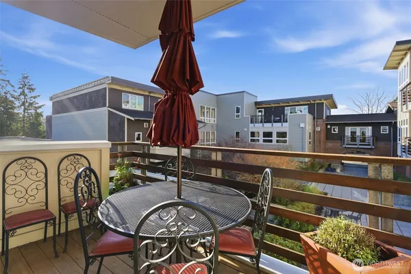 a front view of a house with outdoor seating