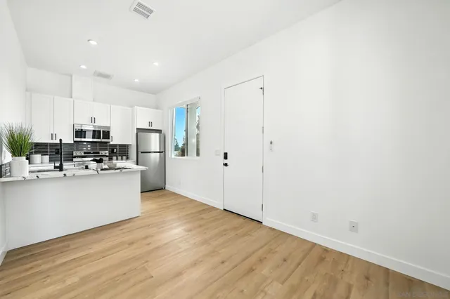 a view of kitchen with wooden floor