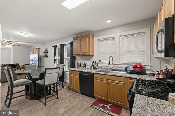 a kitchen with lots of counter top space and dining table