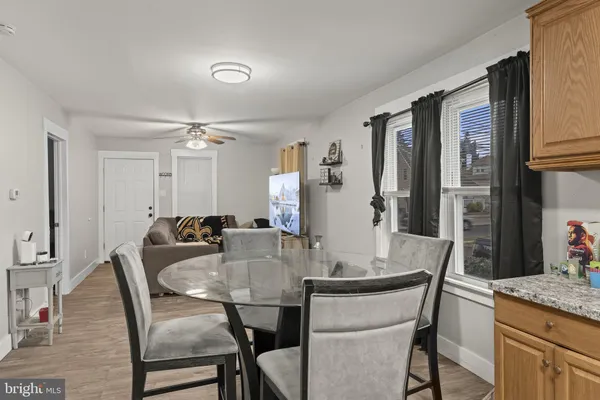 a dining room with furniture and window