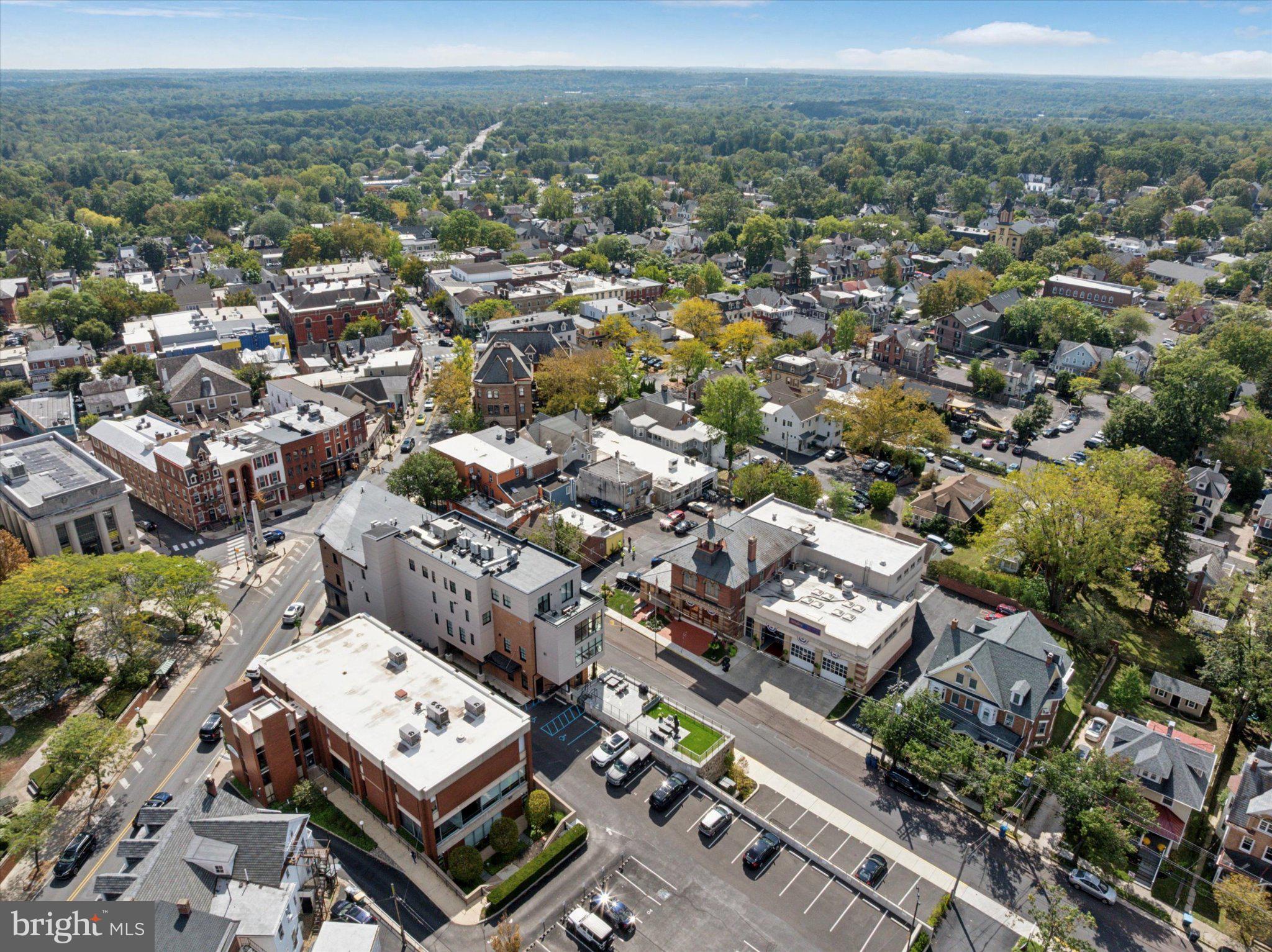 50 North Main Street, Unit 302 Doylestown, PA 18901 - Photo 36 of 38 Charming townscape with lush greenery.