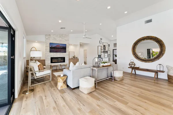 a living room with furniture and a flat screen tv